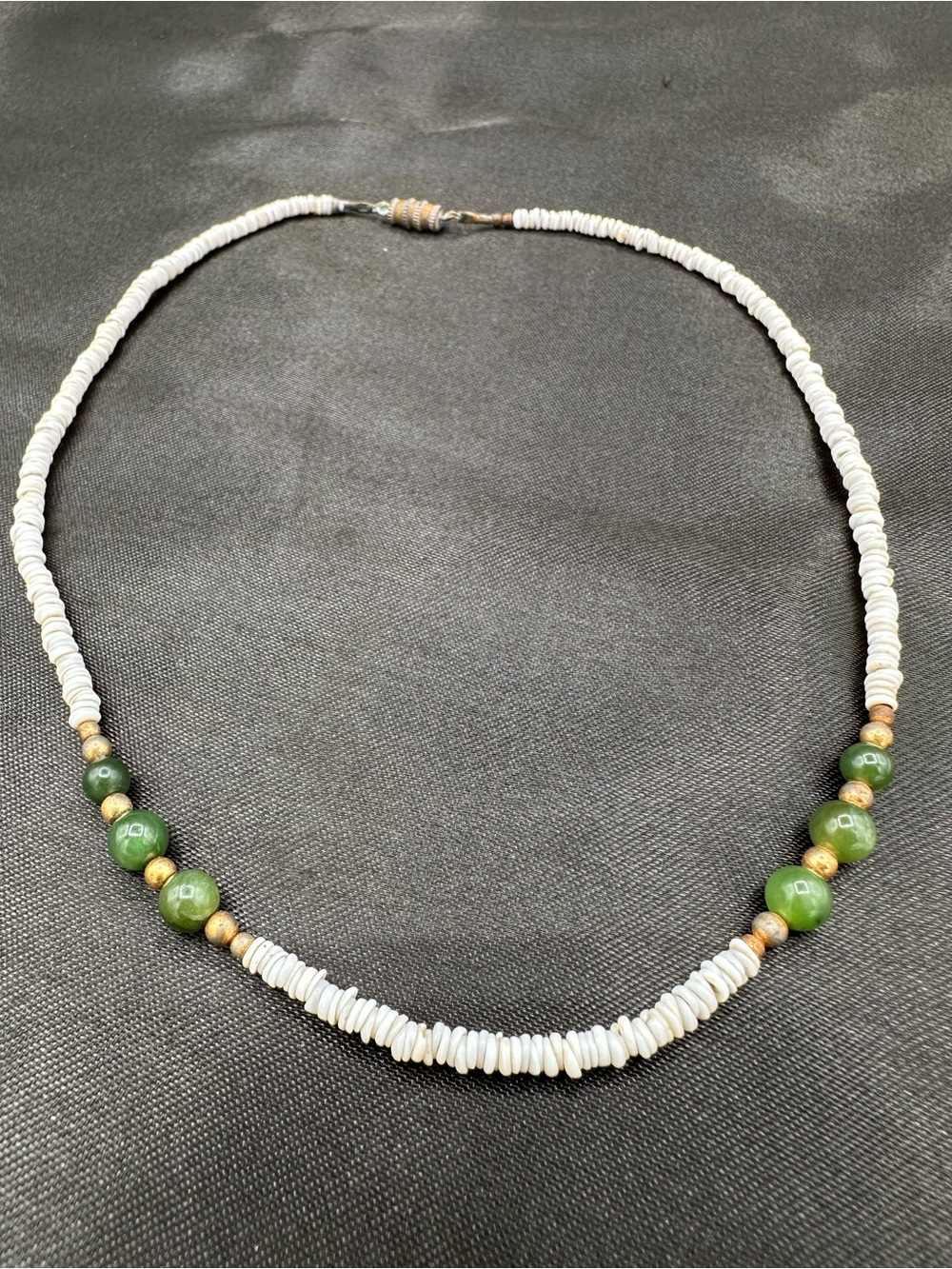 Vintage 1970s Hawaiian surfer-style puka shell and green jade bead necklace.